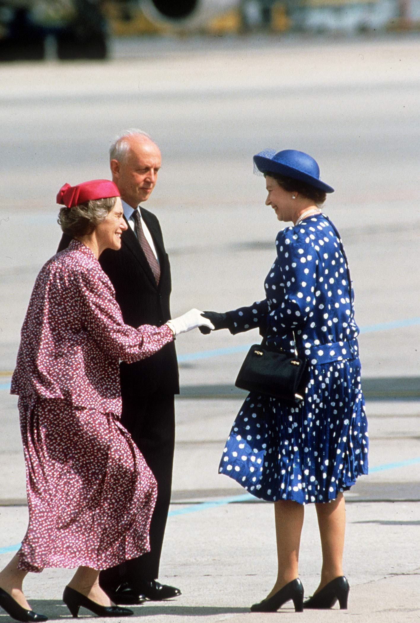 Curtsy For Queen Elizabeth II As She Leaves Hong Kong To Head Home