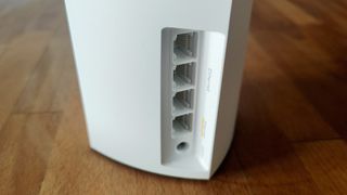 Linksys Atlas Pro 6 (AX5400) review: mesh network node from the back on a table