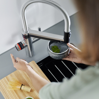 kitchen sink with smart tap and wooden tray