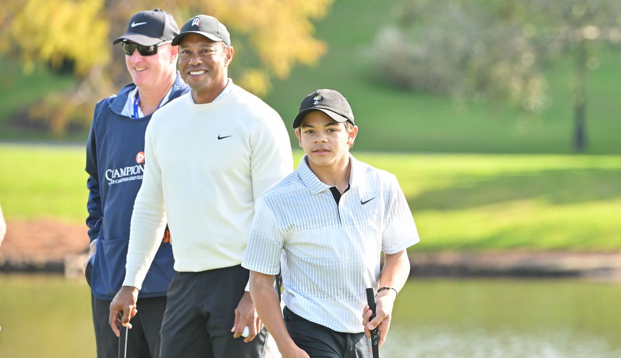 Charlie walks forward while Tiger looks on