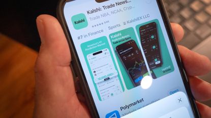 CHICAGO, ILLINOIS - FEBRUARY 25: In this photo illustration, An app for Kalshi, an online prediction market site, is shown on February 25, 2026 in Chicago, Illinois. Online prediction market platforms allow people to place bets on wide-ranging subjects such as sports, finance, politics and currents events. (Photo Illustration by Scott Olson/Getty Images)