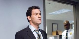 Dominic West in the black jacket and tie