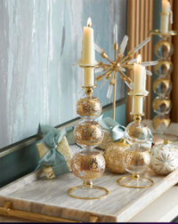 12" Gold Cut Christmas Candleholder for $55, at Neiman Marcus