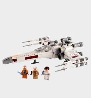 Lego X-Wing and minifigures on a plain background