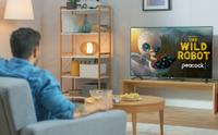 Man watching TV showing The Wild Robot