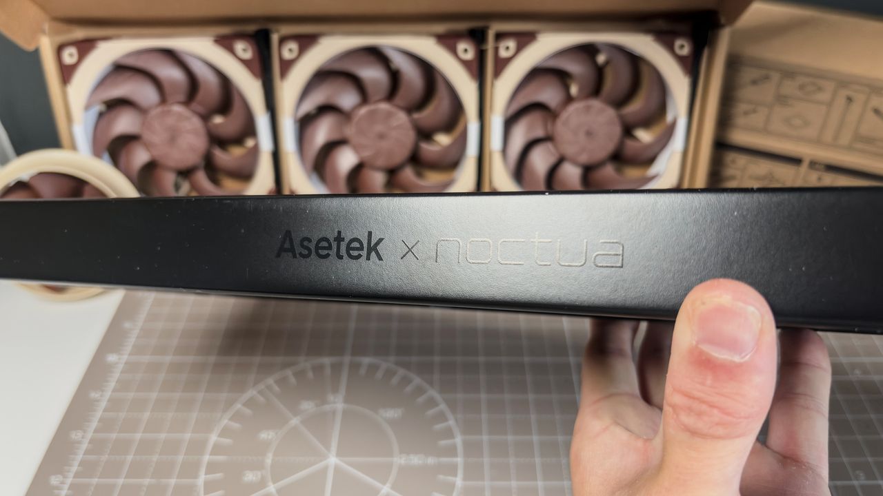 A Noctua NL-LC1 liquid cooler being installed on a test bench for testing.