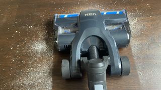 Vax ONEPWR Blade 5 vacuuming flour off hard floor