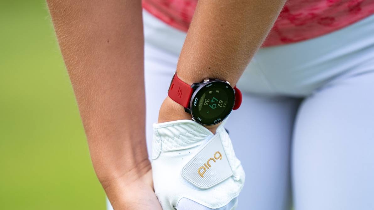 Female golfer wearing a Shot Scope watch