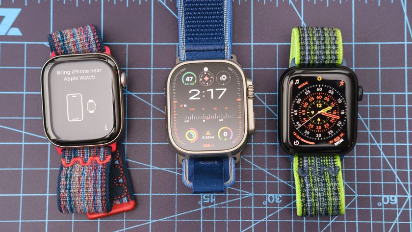 Close-up of the Apple Watch Ultra 3, Apple Watch 11, and Apple Watch SE 3 together on a blue background