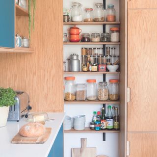 Scandi wooden kitchen with corner pantry.