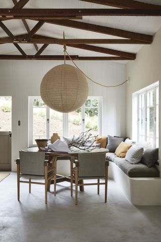 Dining table with large linen pendant light