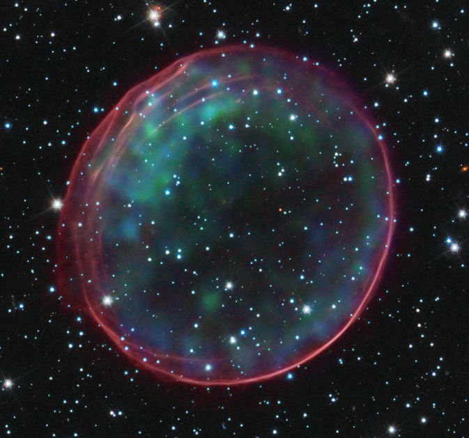 This image of the Type 1a supernova remnant 0509-67.5 was made using data from NASA’s Hubble Space Telescope and Chandra X-ray Observatory. Analyses of Type 1a supernovae has led astronomers to conclude that the universe’s expansion is accelerating, driven by a mysterious force called dark energy.