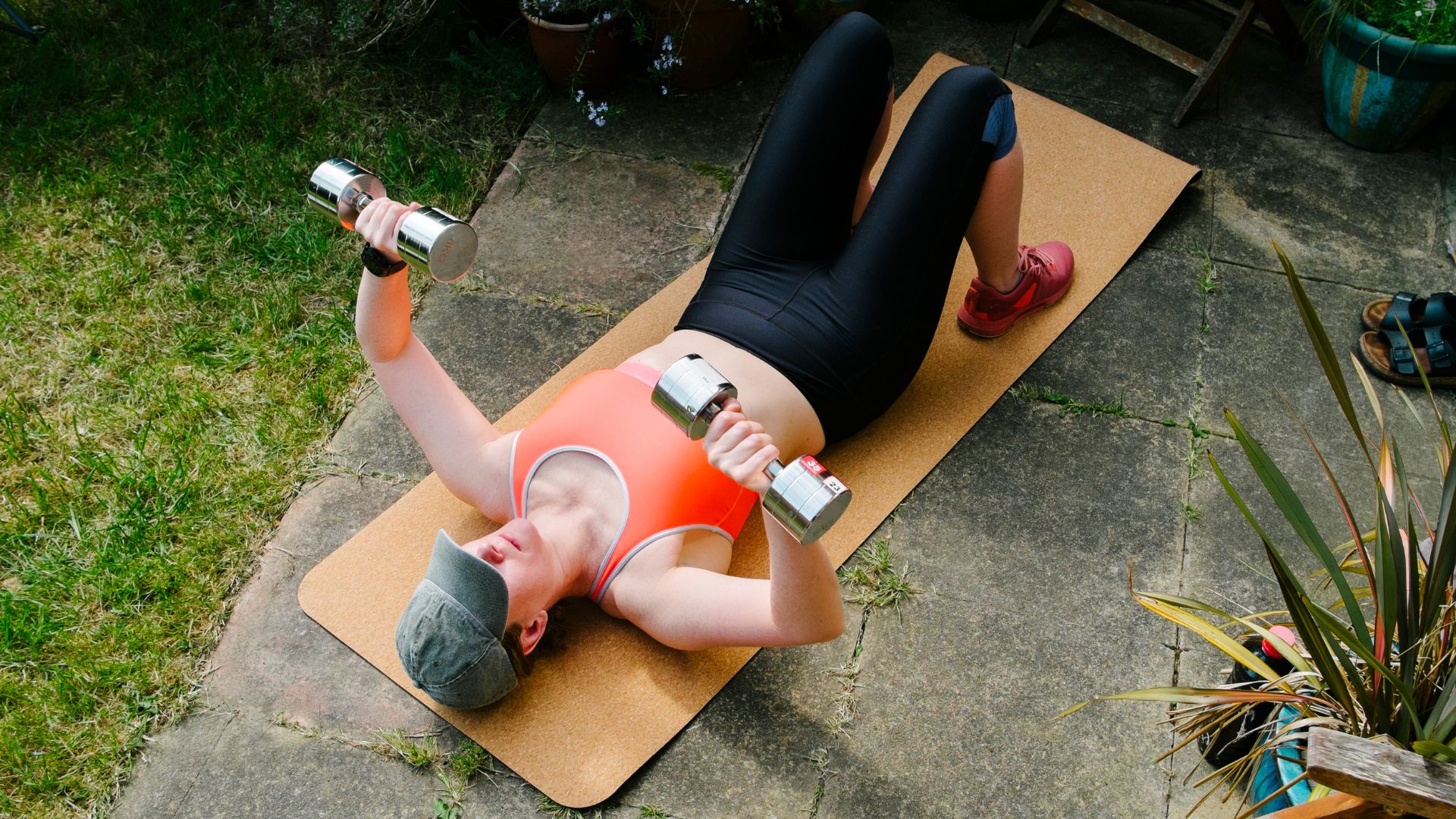 Woman doing floor chest press to learn how to do push-ups for beginners