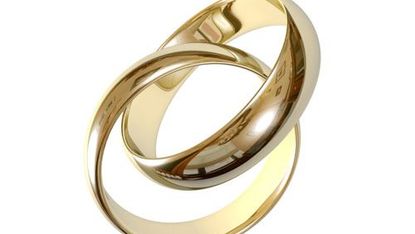 Pair of wedding rings intertwined