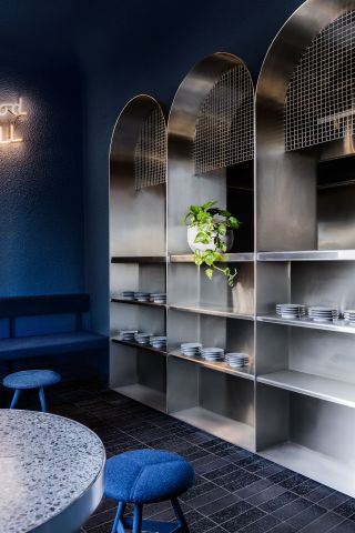 An elegant wall shelf for a cafe with plates