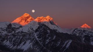 the moon over mountain range