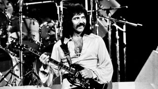 Black Sabbath’s Tony Iommi performing onstage in 1978