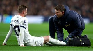 Tottenham midfielder James Maddison receives treatment after suffering an injury against Chelsea in November 2023.