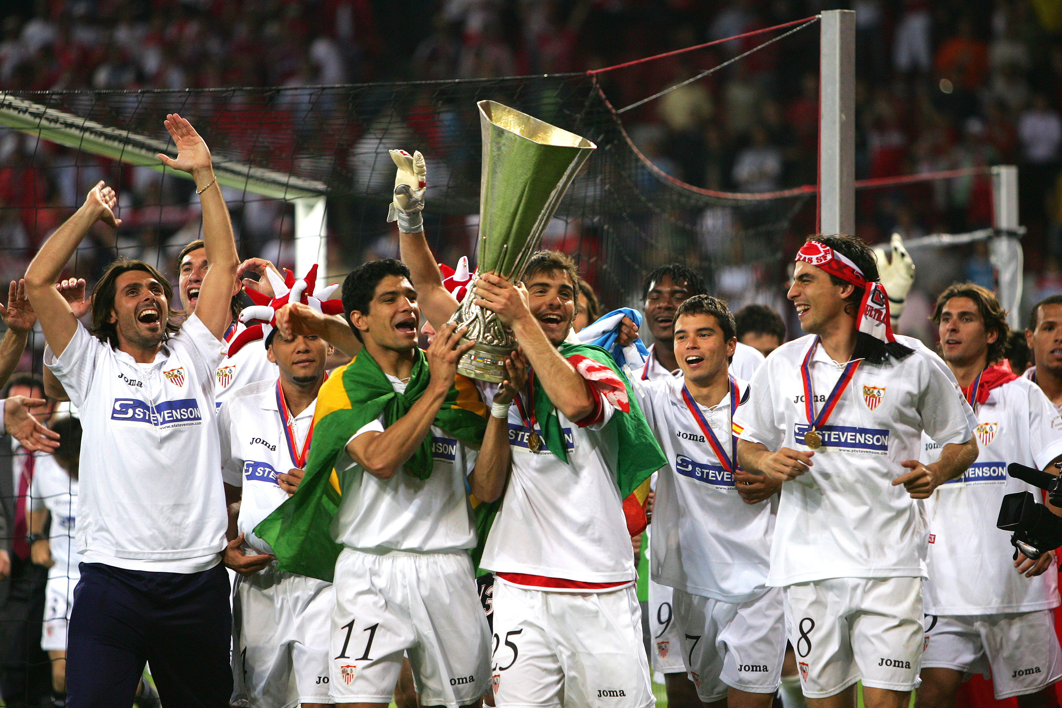 Sevilla players celebrate with the UEFA Cup after their 4-0 win over Middlesbrough in the final in Eindhoven in May 2006.