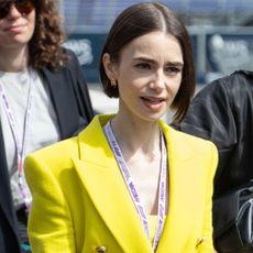 Lily Collins pulled off a neon green and purple color combination at the Formula 1 Monaco Grand Prix