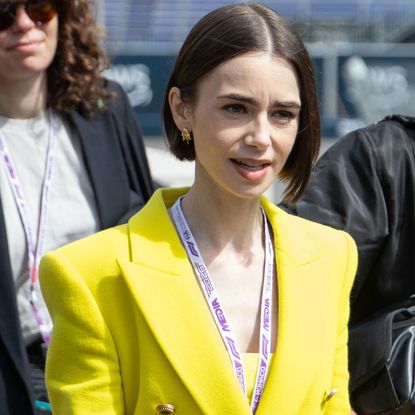 Lily Collins pulled off a neon green and purple color combination at the Formula 1 Monaco Grand Prix