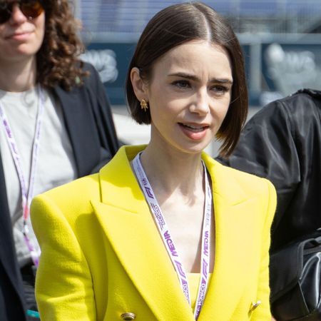 Lily Collins pulled off a neon green and purple color combination at the Formula 1 Monaco Grand Prix
