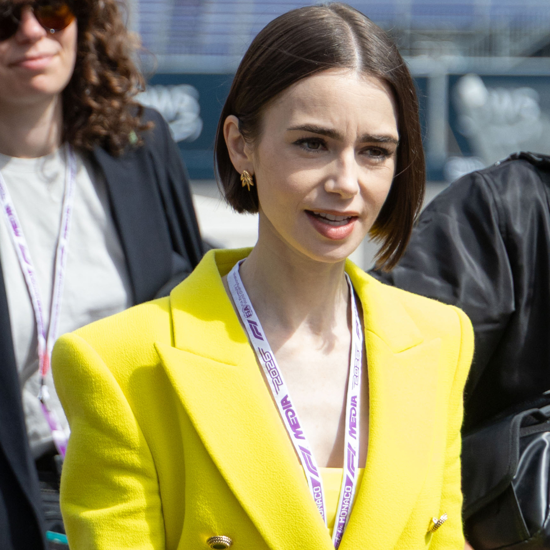 Lily Collins pulled off a neon green and purple color combination at the Formula 1 Monaco Grand Prix