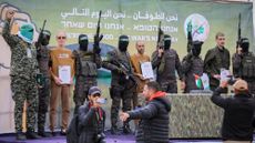 Hamas parades Israeli hostages before releasing them in ceasefire swap