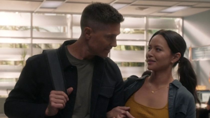 Tim and Lucy holding hands in the precinct in the Season 8 premiere of The Rookie.