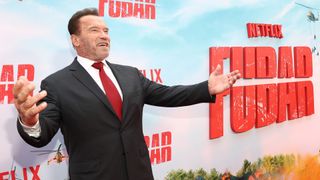 Arnold Schwarzenegger poses for photographs at the premiere for Netflix's Fubar TV show