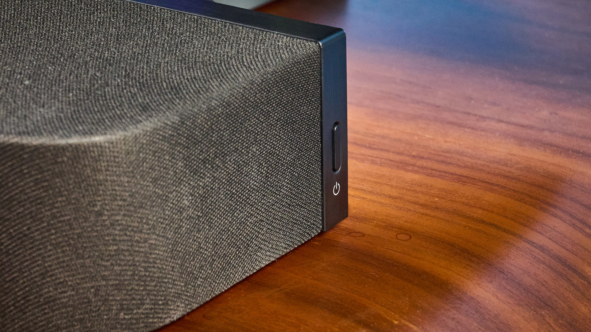 the sony bravia theater bar 7 photographed with the subwoofer with a TV on the tom's guide blue background