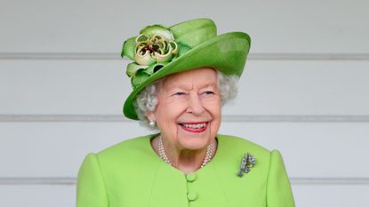 Queen attends the Out-Sourcing Inc. Royal Windsor Cup polo match