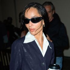 Zo&euml; Kravitz was spotted in NYC wearing a denim chambray blue suit set and flip-flops