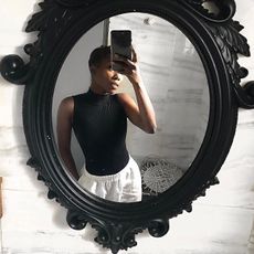 Woman taking a mirror selfie