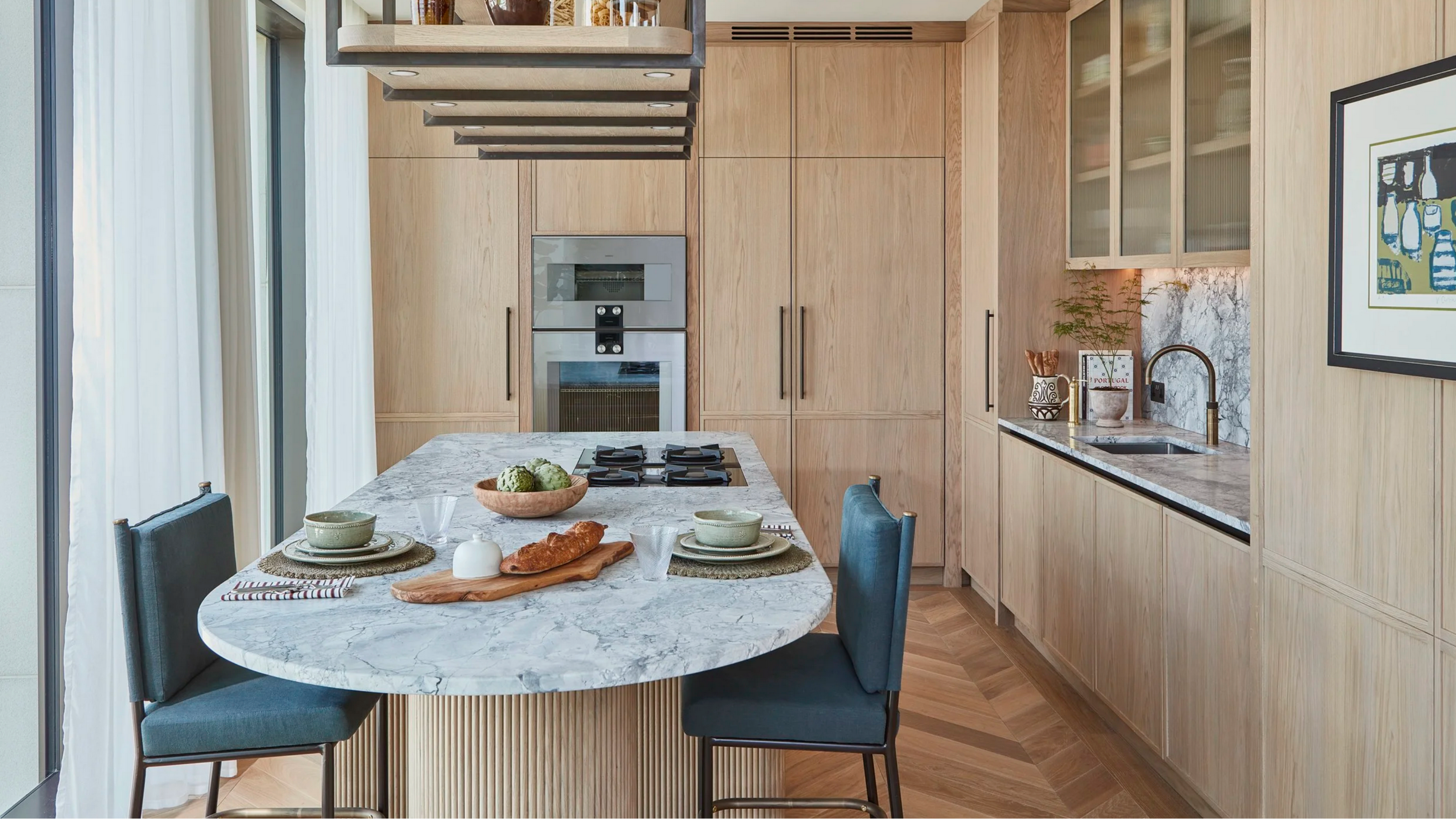 A contemporary kitchen with full-height cabinetry