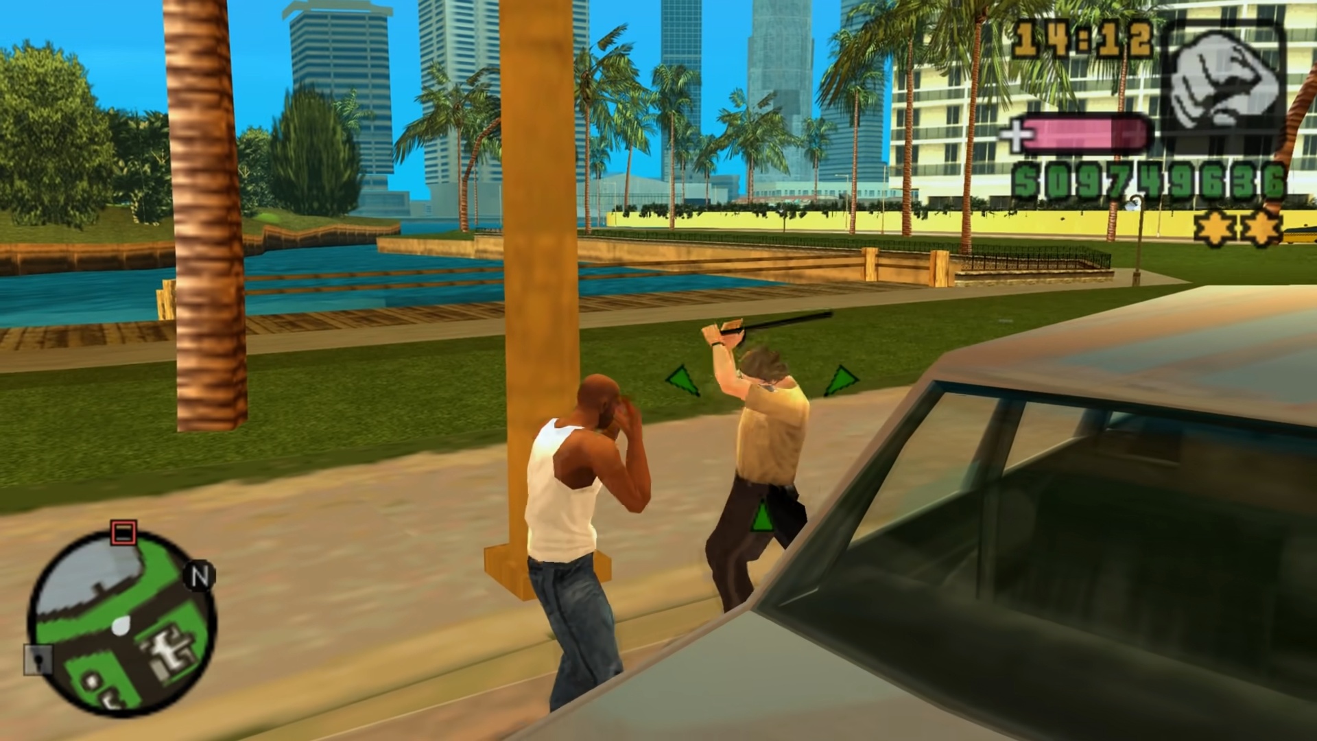 best PSP games: The black protagonist hitting a policeman next to a car with his fists