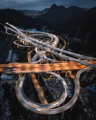 An aerial photo of a highway at night