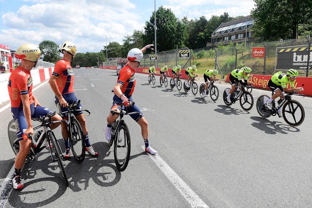 Bahrain-Merida riders watch Trek-Segafredo pass by during team time trial training in Zolder