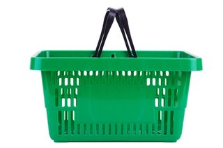 Side view of green plastic shopping basket isolated on white background