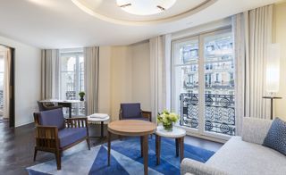 seating area in a Guestroom at Lutetia hotel, Paris, France with blue interior