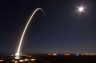 The SpaceX Falcon 9 rocket carrying the EchoStar 23 satellite streaks into space in this long-exposure view of its nighttime launch from Par 39A at NASA's Kennedy Space Center in Florida in the wee hours of March 16, 2017.