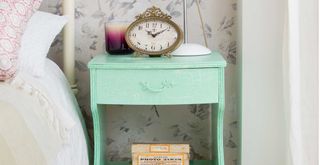 sage green painted side table to show the benefits of buying second hand furniture