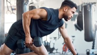 man performing a dumbbell row