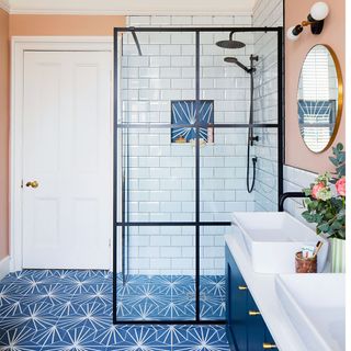 peach and blue bathroom with shower screen