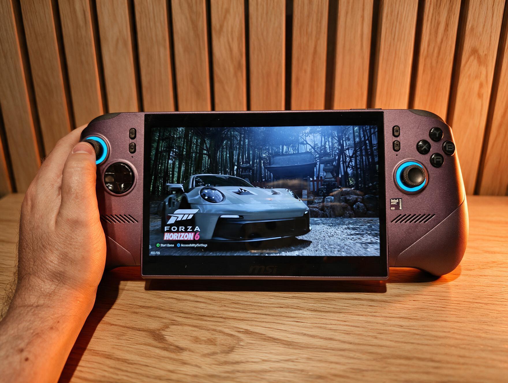 MSI Claw 8 EX AI+ &ndash; a purple gaming handheld with a large screen shows a handheld console displaying a red racing car