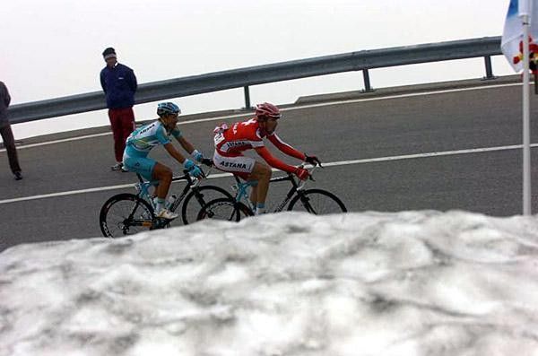 Thomas Frei and Gregory Rast (Astana) pass some snow
