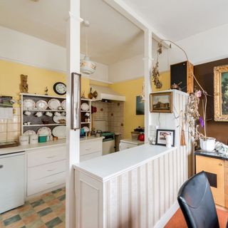 kitchen with yellow wall and open shelves