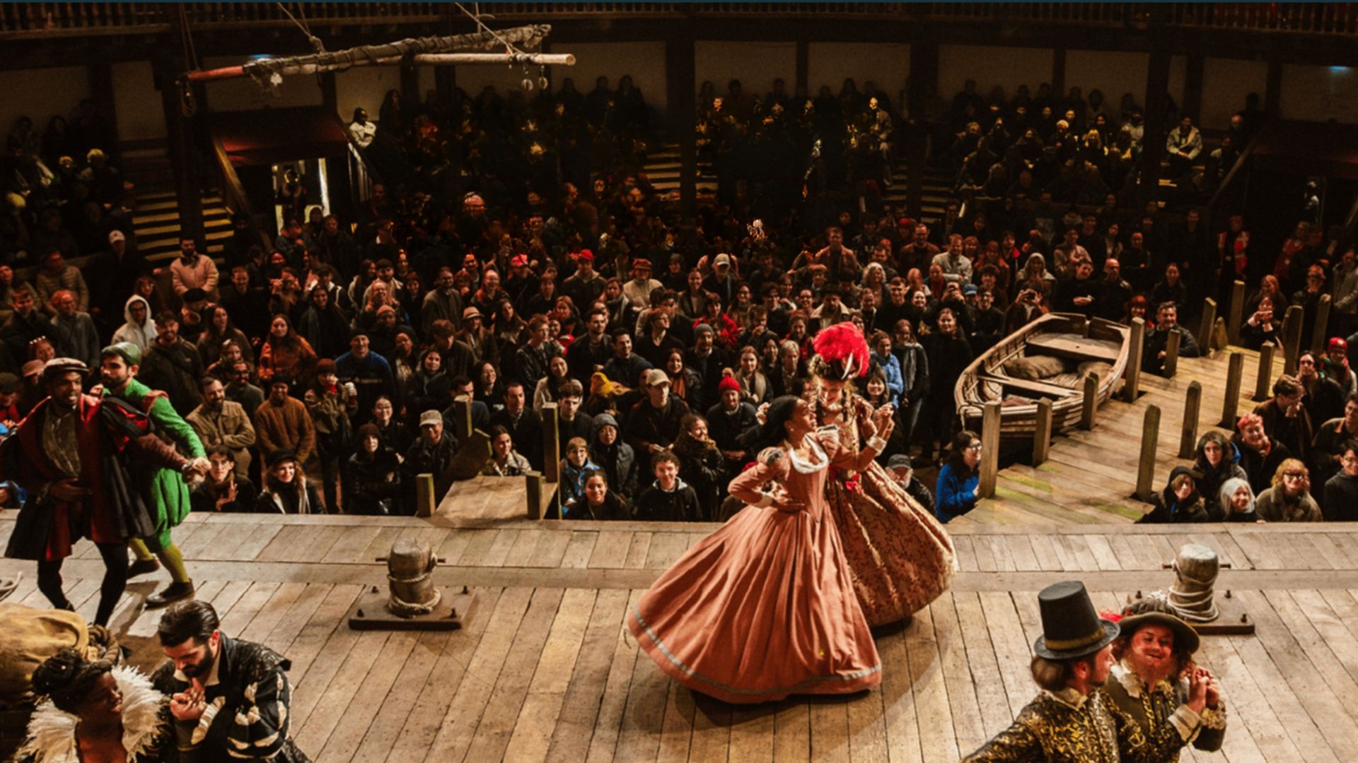 an image of a production at The Globe taking place during one of the midnight matinees