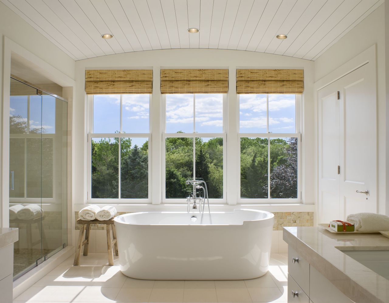 A bathroom with woven shades