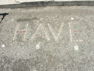 The "have" inscription outside the House of the Faun in Pompeii. The same inscription was found at a family tomb in Naples, likely from a family that had escaped the Mount Vesuvius eruption in A.D. 79.